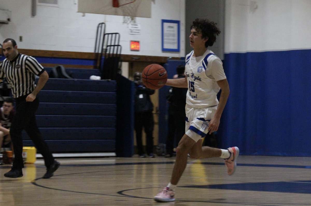 Junior Alexander Lugo possesses the ball at a New Hyde Park home game. (Photo source: Bright Xiao)